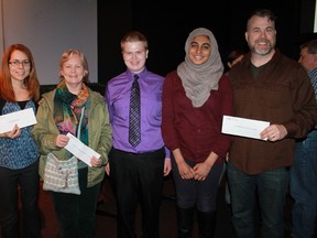 Members of the now-defunct youth sustainability group BSI Gen Y presented cheques to representatives of the city of Sarnia, Green Drinks Sarnia and Nature's Way on Mar. 9, to continue pursuing sustainability initiatives in the future. From left to right: Green Drinks Sarnia's Monica Shepley, Nature's Way's Kim Gledhill, BSI Gen Y members Brandon Vale and Naima Raza and Sarnia Coun. Brian White. 
CARL HNATYSHYN/SARNIA THIS WEEK