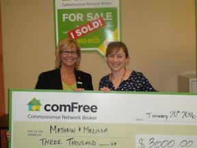 Kim Ewchuk (left) ComFree general manager presents Melissa Couture with a $3,000 cheque reimbursing her real estate commission. Couture was the first client to buy a home through ComFree's new service.