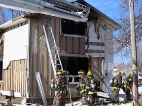 Firefighters respond to a blaze at a home on Cedar Street in Garson on Tuesday afternoon. The fire service received a call around 1 p.m., and by 3 p.m. had extinguished the flames. (John Lappa/Sudbury Star)