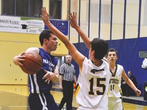 Hawk Brandon Griffin drives to the basket before passing to a teammate at Lethbridge College on March 7. The Hawks lost 76-53 to Crowsnest Consolidated High School in the first round of the 2A South Zone tournament.