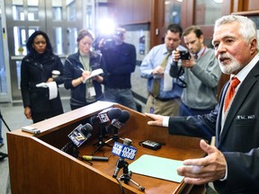 Attorney William Costopoulos announces the resignation of Pennsylvania Supreme Court Justice Michael Eakin, Tuesday, March 15, 2016, at the Pennsylvania Judicial Center in Harrisburg, Pa. Eakin resigned Tuesday in a widening scandal over raunchy and otherwise offensive emails that he and others exchanged with friends and lawyers. (Dan Gleiter/PennLive.com via AP)