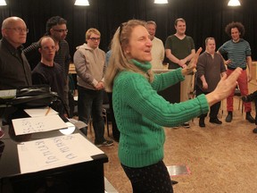 Holly Gwynne-Timothy directs as students from H'art Centre and volunteers from the Melos choir rehearse at H'art for a combined concert later this spring. (Michael Lea/The Whig-Standard)