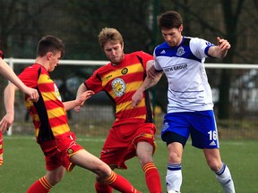 Edmonton forward Daryl Fordyce battles a pair of opponents for the ball during a game against Partick Thistle on Sunday, the first stop in a tour of Scotland. (Tommy Taylor, Partick Thistle FC)