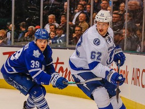 Maple Leafs rookie William Nylander (left) fights for the puck against Lightning defenceman Andrej Sustr during NHL action at the Air Canada Centre in Toronto on Tuesday, March 15, 2016. (Dave Thomas/Toronto Sun)