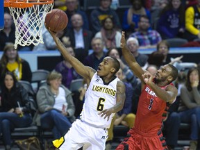 The London Lightning's Al Stewart outraces Akeem Scott of the Brampton A's for a two point lay up during their NBL basketball game at Budweiser Gardens in London, Ontario on Sunday, November 9, 2014. (Free Press file photo)