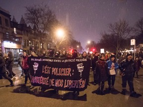 People march during a rally against police brutality in Montreal on Tuesday, March 15, 2016. The protest has been held in Montreal for nearly 20 years, with some ending with smashed-in storefronts and damaged cop cars. THE CANADIAN PRESS/Ryan Remiorz