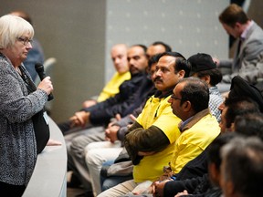 Acting city manager Linda Cochrane (left) councils taxi drivers to be respectful and to listen to councillors before Edmonton city council discussions of Bylaw 17400, the Vehicle for Hire Bylaw, at City Hall in Edmonton, Alta., on Tuesday November 17, 2015. Ian Kucerak/Edmonton Sun/Postmedia Network