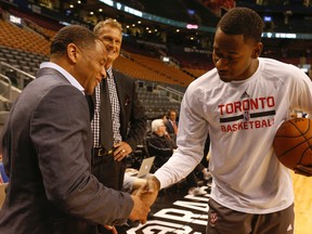 Former Toronto Raptors star Damon Stoudamire (left) chats with TV commentator Leo Rautins and Terrence Ross of the Raptors before a game against the Charlotte Hornets in Toronto on Wednesday April 15, 2015. (Jack Boland/Toronto Sun/Postmedia Network)