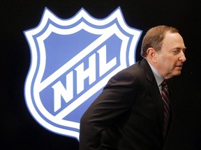NHL commissioner Gary Bettman walks onto the stage for a news conference before the NHL hockey All-Star game skills competition in Nashville on Jan. 30, 2016. (THE CANADIAN PRESS/AP/Mark Humphrey)