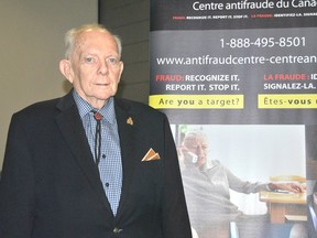 Brock Godfrey of the Canadian Anti-Fraud Centre educates seniors about scams and fraud prevention in Grand Bend last week. (LAURA CUDWORTH, The Beacon Herald)