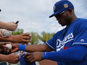 Dodgers right fielder Yasiel Puig will avoid any disciplinary action from MLB after an alleged incident involving the slugger's sister last year. (Joe Camporeale/USA TODAY Sports)