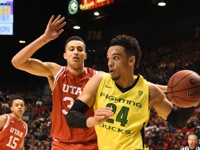 Oregon Ducks forward Dillon Brooks (24) dribbles the ball against Utah Utes forward Kyle Kuzma (35) during the second half in the championship game of the Pac-12 Conference tournament at MGM Grand Garden Arena in Las Vegas on March 12, 2016. (Kyle Terada/USA TODAY Sports)