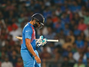 India's Rohit Sharma walks back after his dismissal during the ICC World Twenty20 2016 cricket match against New Zealand at the Vidarbha Cricket Association stadium in Nagpur, India, on, March 15, 2016. (SAURABH DAS/The Associated Press)