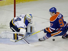 St. Louis Blues goalie Jake Allen makes a save against Edmonton Oilers centre Connor McDavid at Rexall Place on Wednesday. (LARRY WONG)