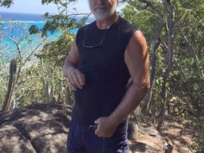 In this March 6, 2015, photo provided by Donna Thompson, her husband David Thompson is pictured at Virgen Gorda, British Virgin Islands. David Thompson, a retired engineer from Kalamazoo, Mich., managed to swim seven hours through rough water to reach land in Puerto Rico after being tossed overboard on March 13, 2016, from his sailboat en route to South Florida. (Donna Thompson via AP)
