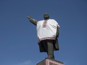 A monument to Soviet state founder Vladimir Lenin is decorated by unidentified people with the Ukrainian traditional shirt containing elements of the national ethnic embroidery, in the southeastern city of Zaporizhzhya, Ukraine, in this October 4, 2014 file photo. The statue was taken down on Thursday. REUTERS/Stringer/Files