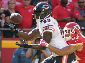 Kansas City Chiefs defensive back Tyvon Branch (27) defends against Chicago Bears tight end Martellus Bennett (83) during a game in Kansas City, Mo., Sunday, Oct. 11, 2015. (AP Photo/Charlie Riedel)