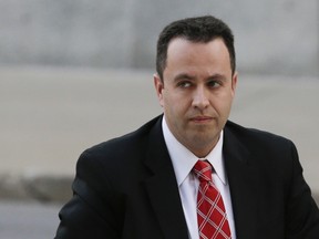 In this Nov. 19, 2015 file photo, former Subway pitchman Jared Fogle arrives at the federal courthouse in Indianapolis. Fogle is being sued by a girl who's one of the victims in the sex crimes case that sent him to prison for more than 15 years. The federal lawsuit filed Tuesday, March 15, 2016, names Fogle and the former head of his anti-obesity charity, Russell Taylor. It also names Taylor's wife. (AP Photo/Michael Conroy, File)