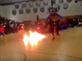 A performer caught fire at Florida high school pep rally. (YouTube/Screengrab)