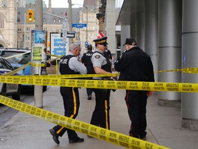 Ottawa Police and RCMP were on the scene of Metcalfe Street near Parliament Hill to investigate an RCMP officer who died of a self-inflicted gunshot. (Patrick Doyle)