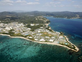 Coral reefs are seen along the coast near the U.S. Marine base Camp Schwab, off the tiny hamlet of Henoko in Nago on the southern Japanese island of Okinawa, in this aerial photo taken by Kyodo October 29, 2015 file photo.  Mandatory credit REUTERS/Kyodo/Files