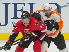 Ottawa Senators right winger Mark Stone and Philadelphia Flyers defenceman Radko Gudas battle for position in the third period at Canadian Tire Centre in Ottawa on Dec. 1, 2015. (Marc DesRosiers/USA TODAY Sports)