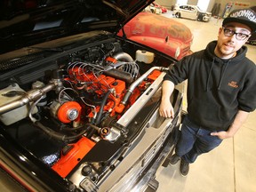 Madison Kruse, 24, with his 1993 Silverado truck. He restored the truck, and put in a 1,000 horsepower motor and it will be on display at World of Wheels.