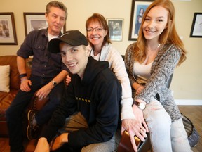 Ryan Stevenson with dad Wayne, mom Cathy and sister Allie in the family's den Thursday, March 17, 2016. (Jack Boland/Toronto Sun)