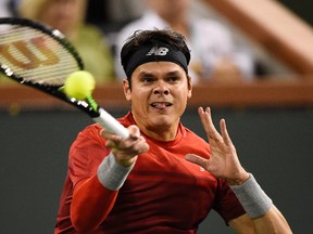 Milos Raonic returns a shot to Gael Monfils at the BNP Paribas Open in Indian Wells, Calif., on Thursday, March 17, 2016. (Mark J. Terrill/AP Photo)