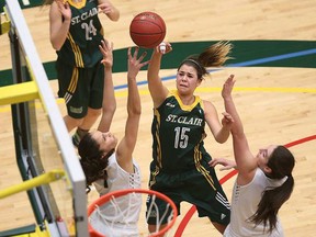 St. Clair Saints Torrie Handsor shoots over Sainte-Foy defenders during the CCAA women’s basketball championships held at St. Clair College in Windsor, Ont., on March 17, 2016. Jason Kryk / Windsor Star