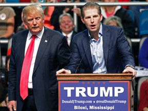 In this Jan. 2, 2016 file photo, Republican presidential candidate Donald Trump, left, listens as his son Eric Trump speaks during a rally in Biloxi, Miss. A law enforcement official says New York City police and the FBI are investigating a threatening letter sent to the Manhattan apartment of Eric Trump. The official says the envelope sent to Eric Trump's apartment on Thursday, March 17, 2016 contained a suspicious white powder and a threatening letter. (AP Photo/Rogelio V. Solis)