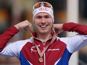 In this file photo taken on Saturday, Feb. 13, 2016, Russia's Pavel Kulizhnikov reacts with his gold medal after winning the men's 1000 meter race of the speedskating single distance World Championships in Kolomna, Russia. (AP Photo/Ivan Sekretarev, file)