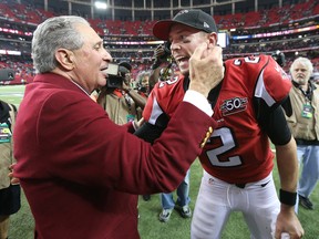 Atlanta Falcons owner Arthur Blank and quarterback Matt Ryan celebrate ending the Panthers perfect season with a 20-13 victory in an NFL football game on Sunday, Dec. 27, 2015, in Atlanta. (Curtis Compton/Atlanta-Journal Constitution via AP)