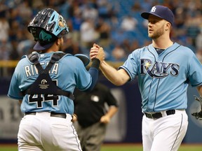Tampa Bay Rays closer Brad Boxberger (right) and catcher Rene Rivera celebrate after a win over the Kansas City Royals at Tropicana Field. (Kim Klement/USA TODAY Sports)