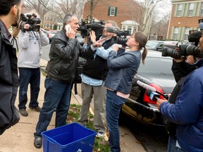 Jamal Khweis, centre, who identified himself as the father of the 26-year-old man fighting with the Islamic State group who gave himself up to Iraqi Kurdish forces in northern Iraq on Monday, and who said when he gave up that he is a Palestinian from the United States, speaks outside a home in Alexandria, Va., on March 14, 2016. (AP Photo/Andrew Harnik)