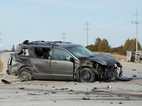 Debris surrounds a minivan involved in a collision with a transport truck and a trailer at the intersection of Elginfield and Denfield Roads north of London, Ont., on Thursday, March 17. CRAIG GLOVER/THE LONDON FREE PRESS/POSTMEDIA NETWORK