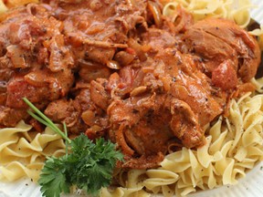 This Jan. 18, 2016 photo shows chicken paprikash with egg noodles in Concord, N.H. This easy weeknight chicken dish sports a sauce rich with tomatoes and paprika. Stirring sour cream into it just before serving transforms it into a true comfort food. (AP Photo/Matthew Mead)