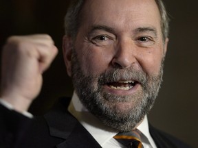Tom Mulcair speaks to reporters in the Foyer of the House of Commons in Ottawa on Wednesday, Dec. 2, 2015. Mulcair's supporters are starting to speak out in favour of the NDP leader ahead of the party's convention. THE CANADIAN PRESS/Adrian Wyld