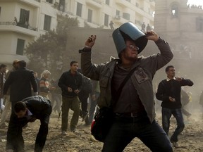 An opposition demonstrator throws a stone during rioting with pro-Mubarak supporters near Tahrir Square in Cairo February 3, 2011. Five years ago thousands of protesters took to the streets demanding the end of the 30-year reign of President Mubarak as Egypt became the second country to join the Arab Spring. (REUTERS/Goran Tomasevic)