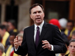 Finance Minister Bill Morneau stands in the House of Commons during Question Period on Parliament Hill, Thursday March 10, 2016. THE CANADIAN PRESS/Fred Chartrand