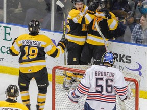 Kingston Frontenacs' Jason Robertson, left, and Ted Nichol celebrate with Ryan Cranford after Cranford scored the first goal of the game against the Oshawa Generals during the first period of Ontario Hockey League action at the Rogers K-Rock Centre on Friday night. The teams will meet in the first round of the OHL playoffs beginning next week. (Julia McKay/The Whig-Standard)