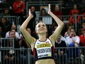 Canada's Brianne Theisen-Eaton celebrates after she won the women's 800-metre sprint and the pentathlon event during the World Indoor Athletics Championships in Portland, Ore., on Friday, March 18, 2016. (Elaine Thompson/AP Photo)