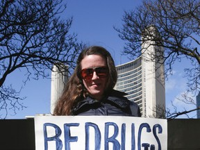 Kathleen, who wouldn't provide her last name, at  a bedbug protest held in front to City Hall on Friday March 18, 2016. Veronica Henri/Toronto Sun/Postmedia Network