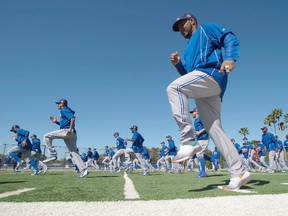 Toronto Blue Jays first baseman Edwin Encarnacion leads a running drill at spring training in Dunedin, Fla., on Feb. 26, 2016. (THE CANADIAN PRESS/Frank Gunn)