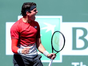 Milos Raonic reacts after defeating David Goffin in his semifinal David Goffin in the BNP Paribas Open at the Indian Wells Tennis Garden. Raonic won 6-3, 3-6, 6-3. (Jayne Kamin-Oncea-USA TODAY Sports)