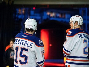 Current Oilers defensive pair Griffin Reinhart and Jordan Oesterle are seen standing for the anthem prior to a game with the Bakersfield Condors back in January. (File)