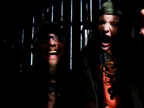 Tim Miller/Intelligencer File Photo
Troy Morrissey (left) and his son, Oden Gomes, snarl at the camera as they pose for a photo in a barn on Morrissey's property in Ameliasburgh in this file photo. Morrissey is an organizer of the horror-themed film festival, Creepfest, playing at Picton’s Regent Theatre the end of this month.