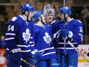 Toronto Maple Leafs forward Frederik Gauthier and forward William Nylander and goaltender Garret Sparks and forward Josh Leivo celebrate a win over the Buffalo Sabres at the Air Canada Centre. Toronto defeated Buffalo 4-1. (John E. Sokolowski/USA TODAY Sports)