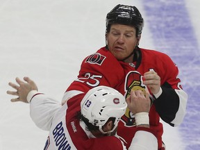 Senators' Chris Neil fights Mike Brown of the Montreal Canadiens on March 19. (Tony Caldwell, Ottawa Sun)