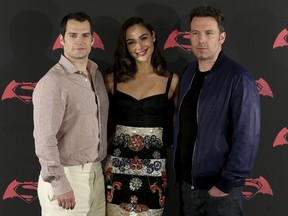 Actors Henry Cavill, left, Ben Affleck, right, and Gal Gadot pose during a photocall to promote the movie "Batman v Superman: Dawn Of Justice" in Mexico City, Mexico, March 19, 2016. *REUTERS/Henry Romero)